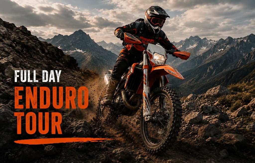 Enduro rider on a rocky mountain trail at golden hour